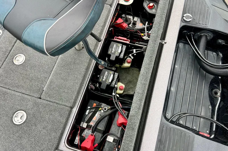 Slide: The Image of 2017 Ranger Z519 boat interior showing battery compartment and seating. - 23