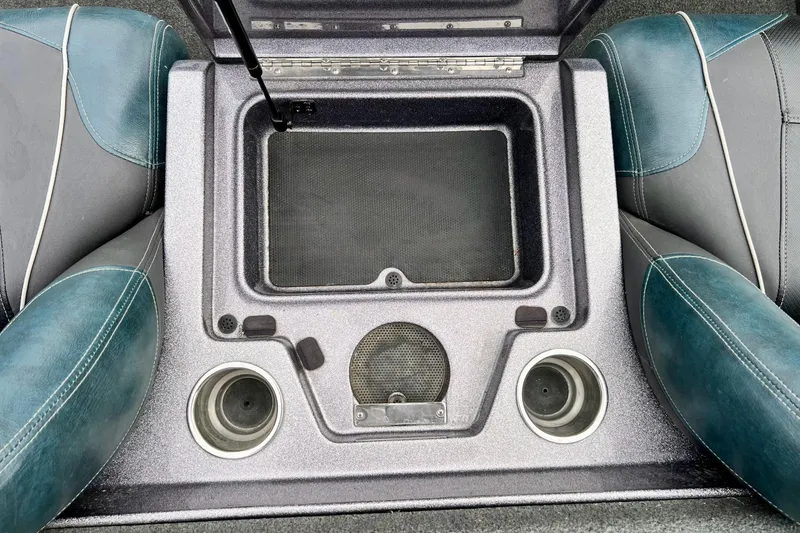 Slide: The Image of 2017 Ranger Z519 boat interior with storage compartment and cup holders. - 28