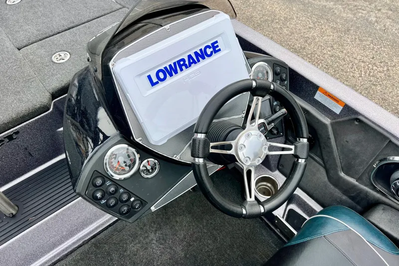 Slide: The Image of 2017 Ranger Z519 boat dashboard with Lowrance display and steering wheel. - 30