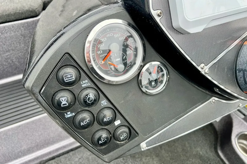 Slide: The Image of Dashboard controls of a 2017 Ranger Z519 boat with speedometer and fuel gauge. - 31