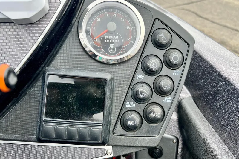 Slide: The Image of Control panel of a 2017 Ranger Z519 boat with RPM gauge and various switches. - 35