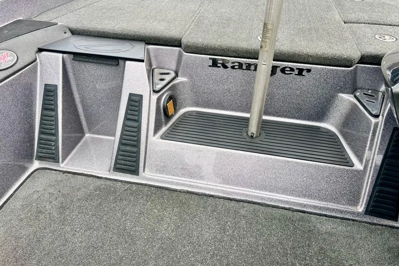 Slide: The Image of 2017 Ranger Z519 boat interior with textured flooring and storage compartments. - 36