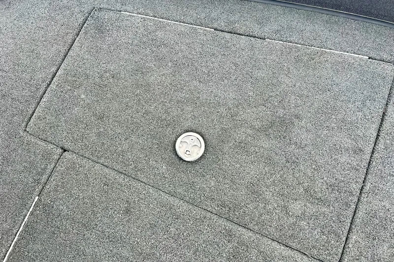 Slide: The Image of 2017 Ranger Z519 boat deck with gray carpet and circular latch. - 39