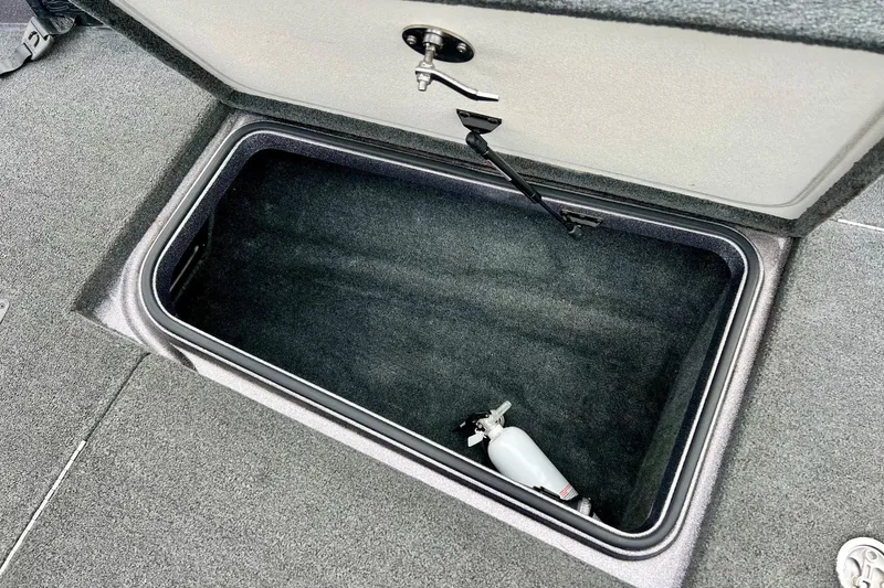 Slide: The Image of 2017 Ranger Z519 boat storage compartment with fire extinguisher. - 40