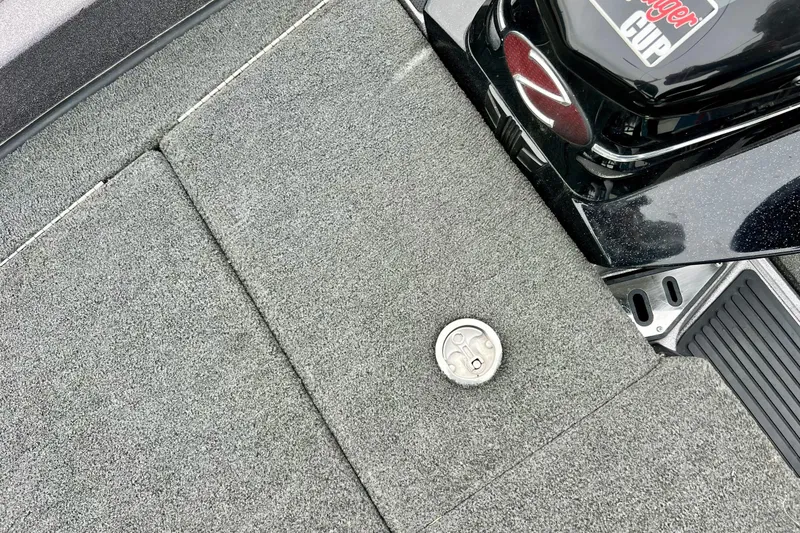 Slide: The Image of 2017 Ranger Z519 boat deck with carpeted surface and storage compartment. - 41