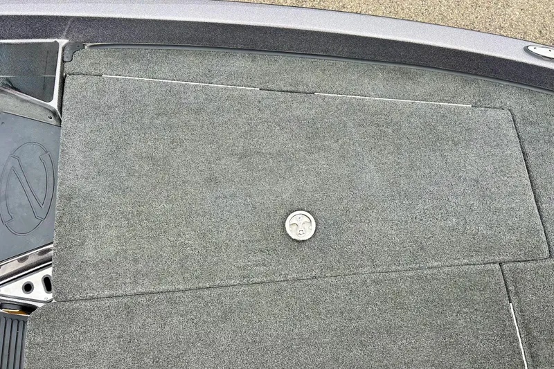 Slide: The Image of 2017 Ranger Z519 boat deck with gray carpet and storage hatch. - 43