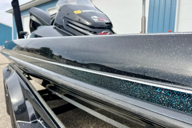 Slide: The Image of 2017 Ranger Z519 boat with sparkling black finish, close-up view. - 7