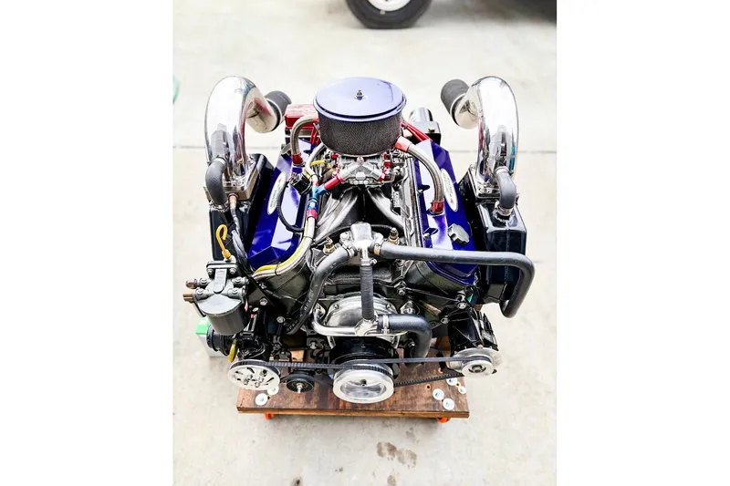 Slide: The Image of Engine of a 2000 Active Thunder 32 boat, showcasing intricate components and design. - 26