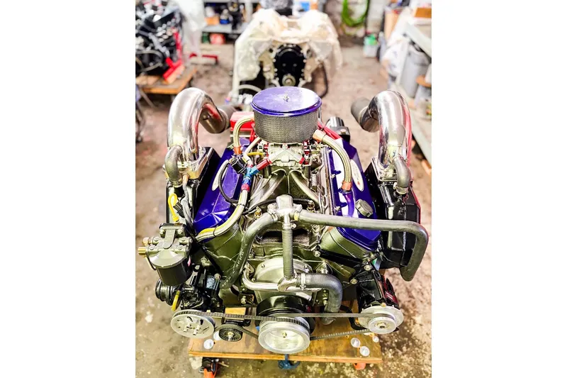 Slide: The Image of 2000 Active Thunder 32 engine in workshop, showcasing intricate mechanical components and vibrant colors. - 27