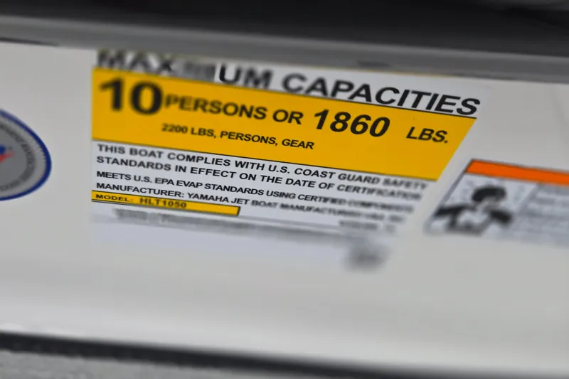 Slide: The Image of 2025 Yamaha Boats AR220 capacity label, max 10 persons or 1860 lbs, U.S. Coast Guard compliant. - 13