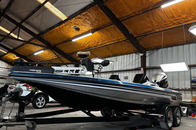 Slide: The Image of Yamaha VMAX SHO outboard motor on 2014 Skeeter ZX20 boat by the water. - 10