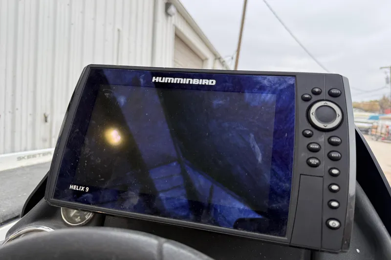 Slide: The Image of 2014 Skeeter ZX20 boat with Yamaha 250 engine in a parking lot. - 12