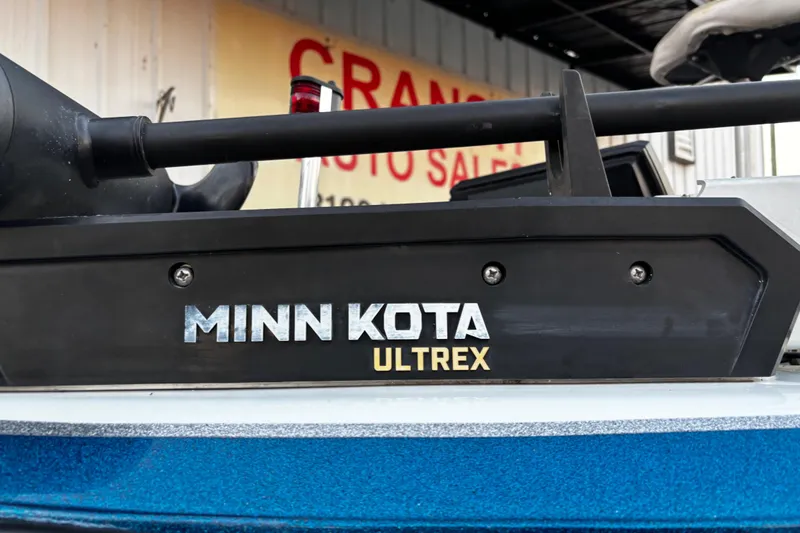 Slide: The Image of 2014 Skeeter ZX20 boat with dual consoles and Yamaha 250 engine by a lake. - 26