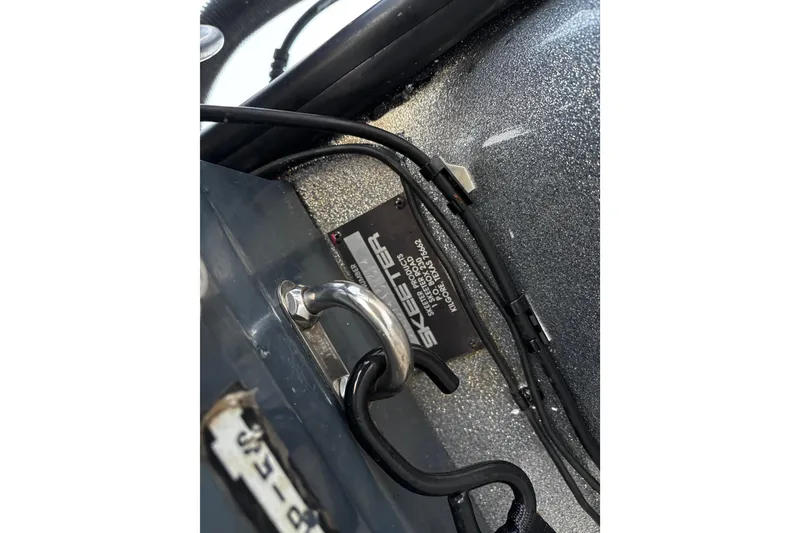 Slide: The Image of 2014 Skeeter ZX20 boat interior with open storage compartment. - 32