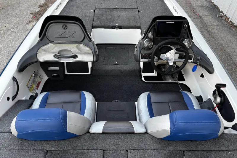 Slide: The Image of Foot pedal control on 2014 Skeeter ZX20 boat, featuring Minn Kota branding. - 34