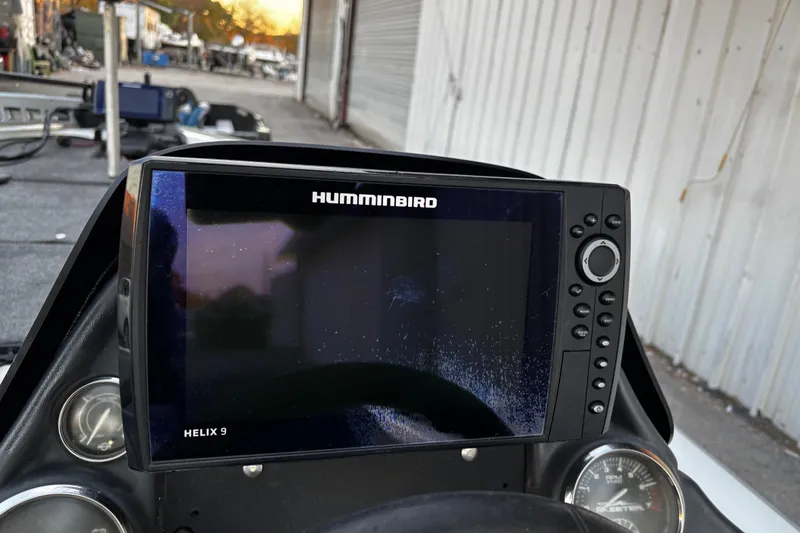 Slide: The Image of 2014 Skeeter ZX20 boat storage compartment with open lid, showcasing interior space. - 36