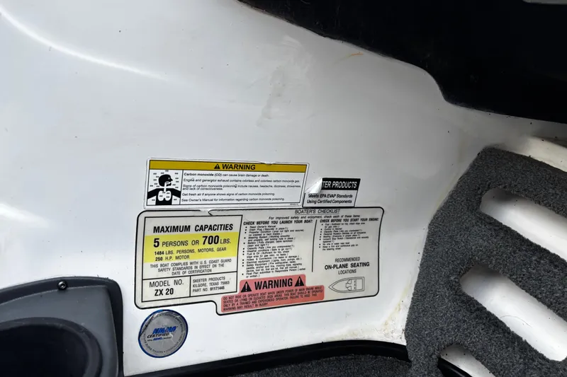 Slide: The Image of 2014 Skeeter ZX20 boat interior with steering wheel and seating. - 37