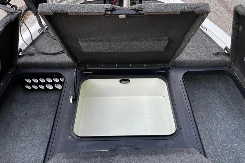 Slide: The Image of 2014 Skeeter ZX20 boat interior with blue and gray seating arrangement. - 38