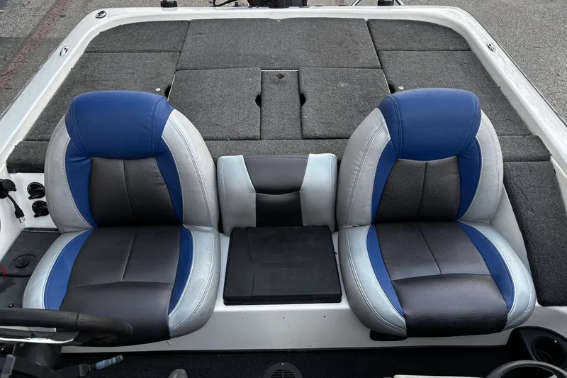 Slide: The Image of 2014 Skeeter ZX20 boat storage compartments with open lids, showcasing interior space. - 42