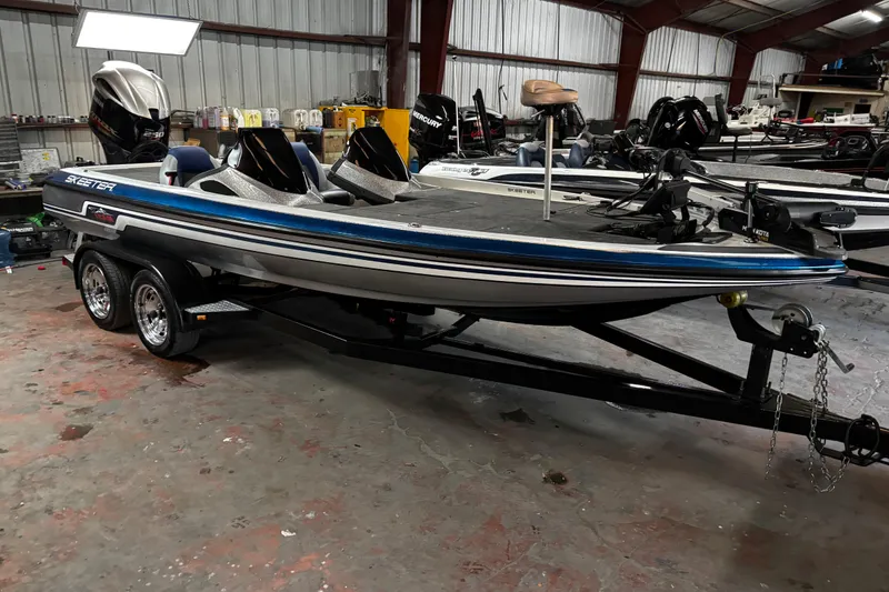 Slide: The Image of 2014 Skeeter ZX20 boat with Yamaha engine on trailer by the water. - 6