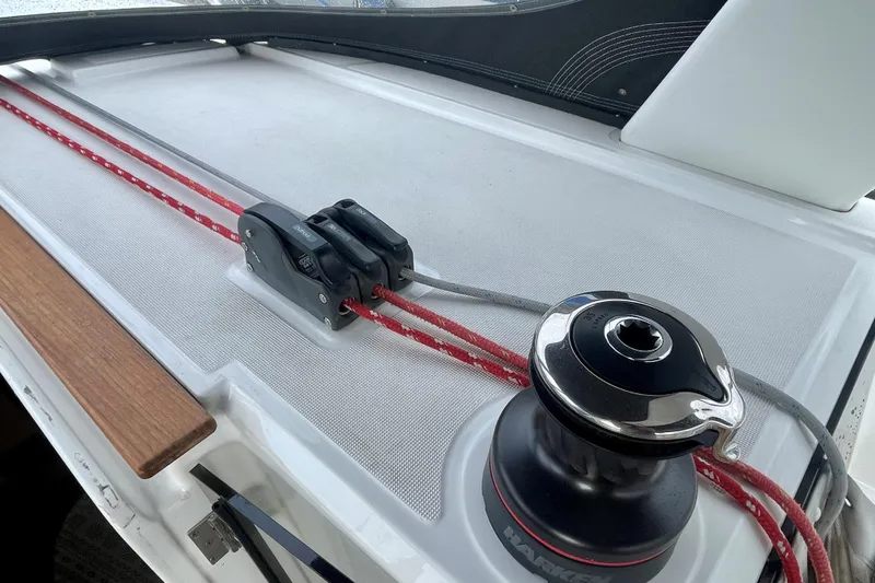 Slide: The Image of Beneteau Oceanis 38.1 sailboat deck with winch and red ropes, 2020 model. - 16