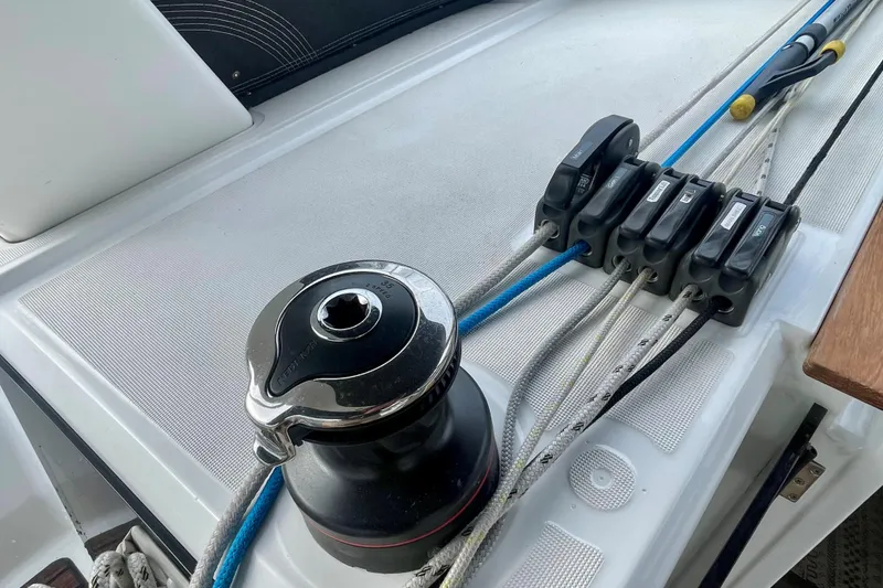 Slide: The Image of Deck of 2020 Beneteau Oceanis 38.1 sailboat with winch and rope clutches. - 17