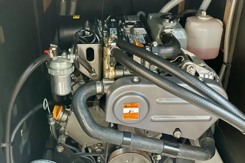 Slide: The Image of Engine compartment of a 2020 Beneteau Oceanis 38.1 sailboat, showcasing mechanical components. - 21