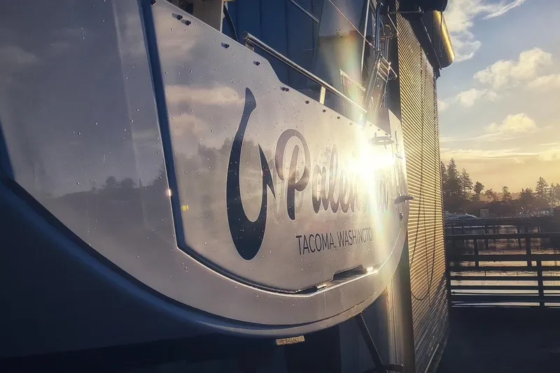 Slide: The Image of Beneteau Oceanis 38.1 yacht in Tacoma, Washington, reflecting sunset light. - 25