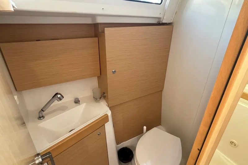 Slide: The Image of Compact bathroom in 2020 Beneteau Oceanis 38.1 yacht with sink and toilet. - 8