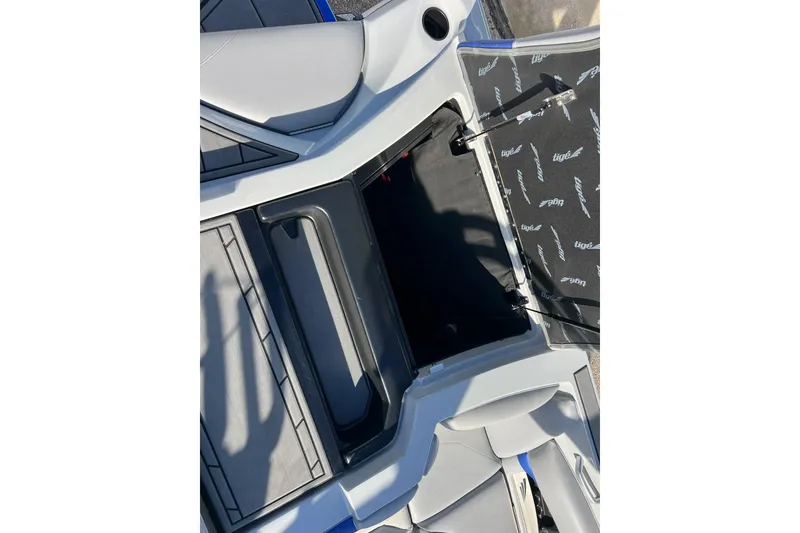 Slide: The Image of 2017 Tigé R21 boat interior storage compartment with open hatch. - 23