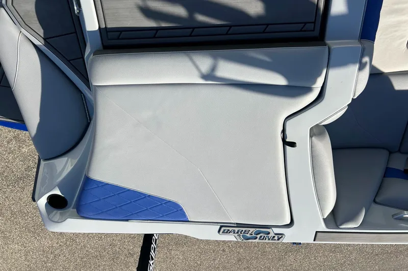 Slide: The Image of 2017 Tigé R21 boat interior with gray and blue seating, "Barefoot Only" decal. - 24