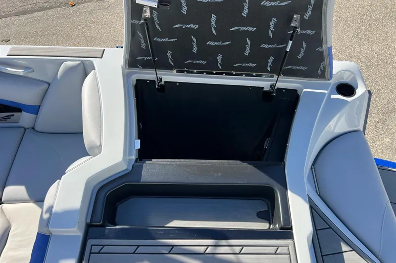 Slide: The Image of 2017 Tigé R21 boat interior storage compartment with open hatch. - 25