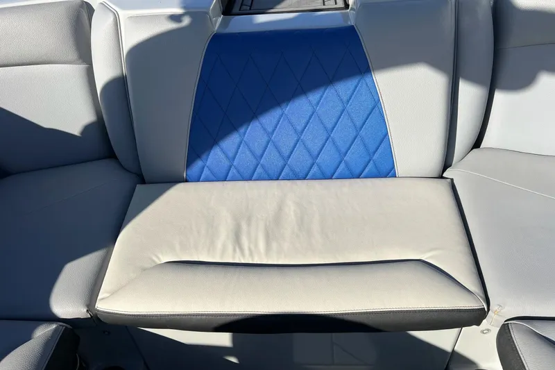 Slide: The Image of 2017 Tigé R21 boat seat with blue and gray upholstery, featuring diamond stitching. - 29