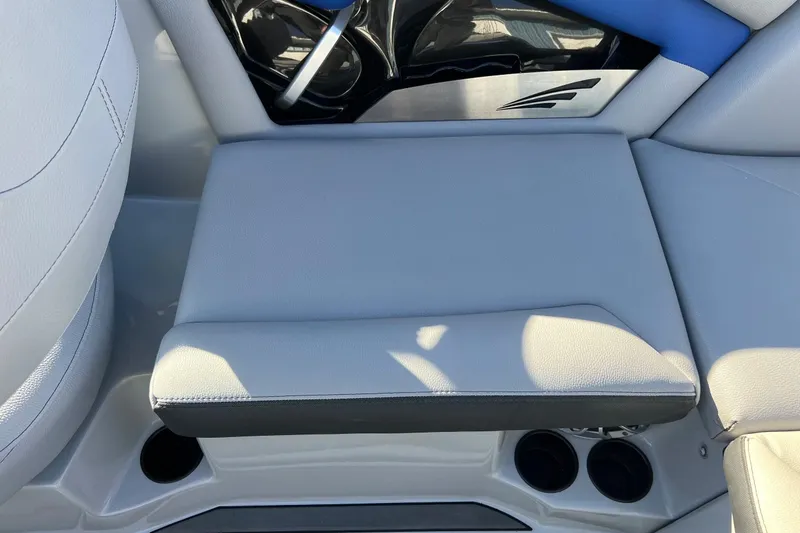 Slide: The Image of 2017 Tigé R21 boat interior with gray seating and cup holders. - 30