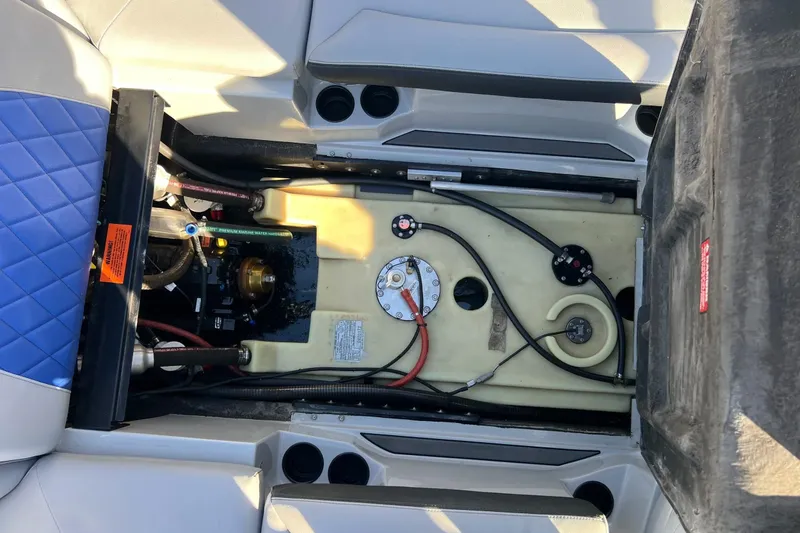 Slide: The Image of 2017 Tigé R21 boat interior showing engine compartment and fuel system components. - 34
