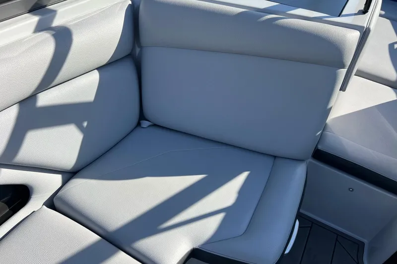 Slide: The Image of 2017 Tigé R21 boat interior with light gray seating and modern design. - 35