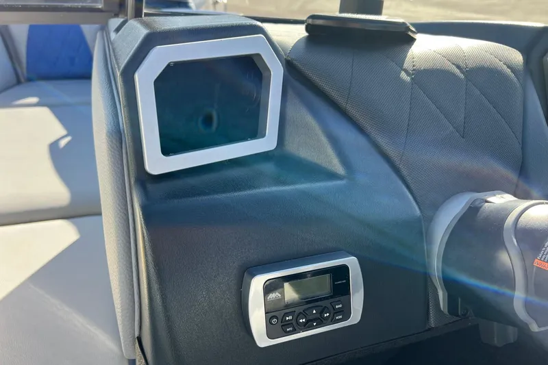 Slide: The Image of 2017 Tigé R21 boat dashboard with control panel and display screen. - 38