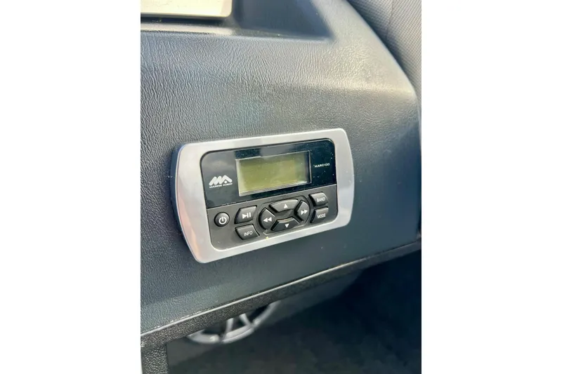 Slide: The Image of Control panel in 2017 Tigé R21 boat dashboard, featuring buttons and display. - 4