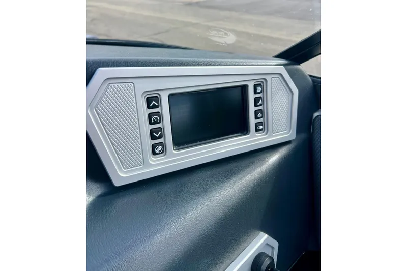 Slide: The Image of 2017 Tigé R21 boat dashboard with control panel and display screen. - 5