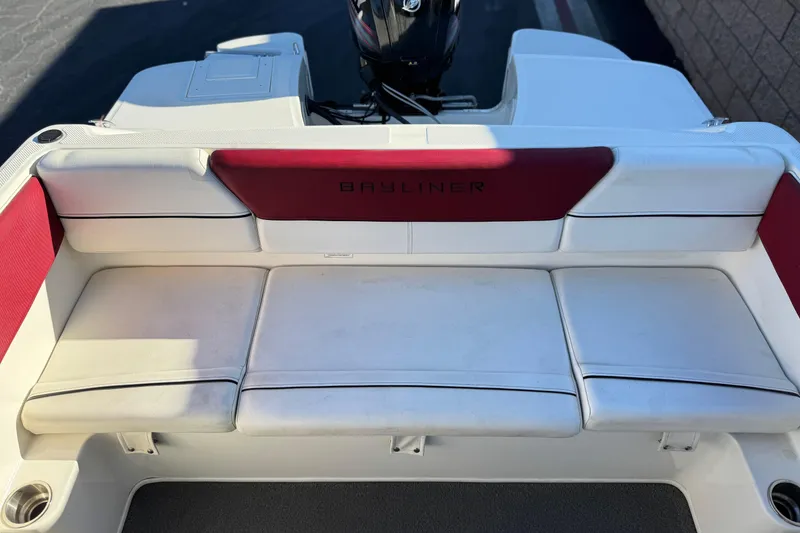 Slide: The Image of 2016 Bayliner 180 Bowrider boat interior with white and red seating. - 11