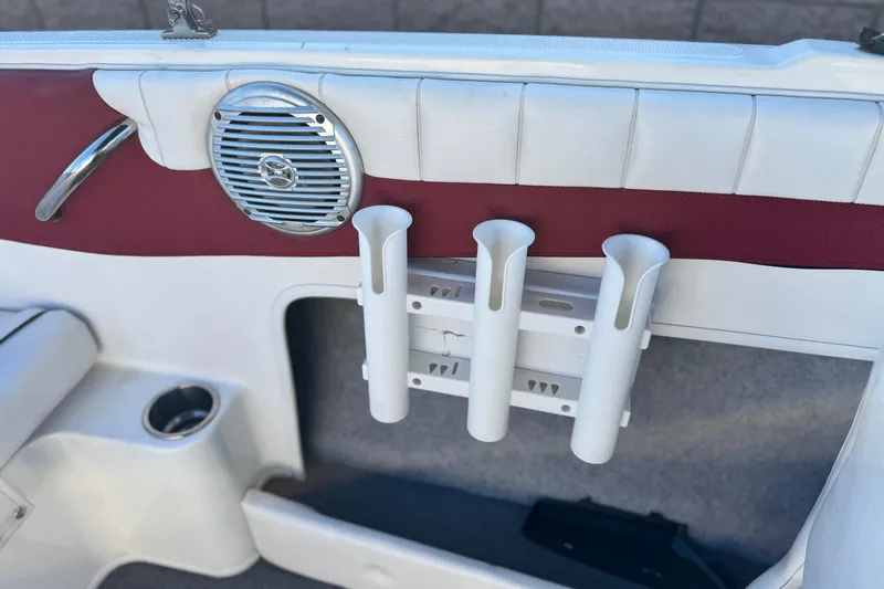 Slide: The Image of 2016 Bayliner 180 Bowrider interior with speaker and rod holders. - 13