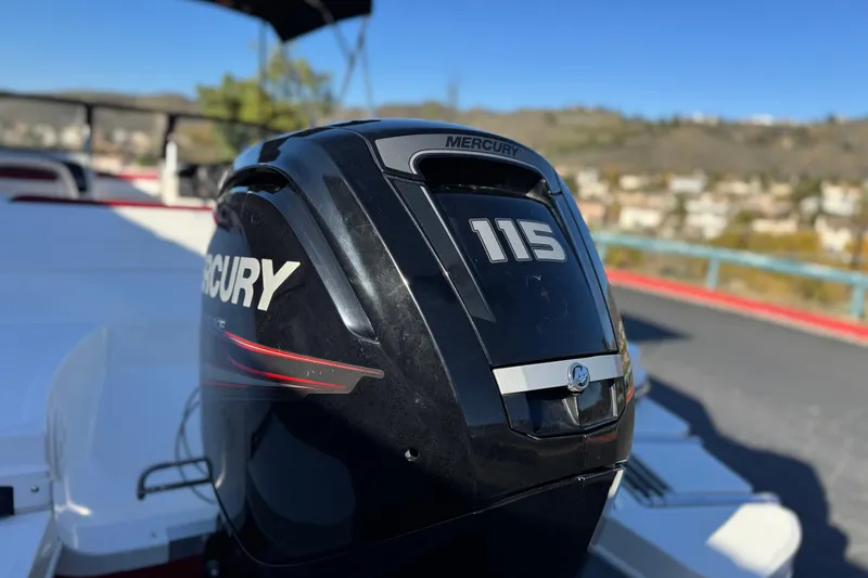 Slide: The Image of 2016 Bayliner 180 Bowrider with Mercury 115 outboard motor, parked outdoors. - 7