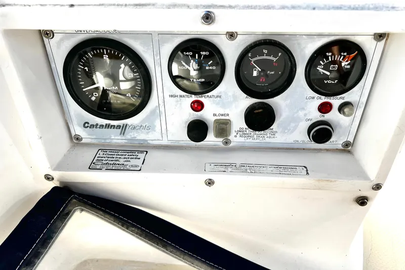 Slide: The Image of Control panel of a 1985 Catalina 36 yacht with gauges and switches. - 22