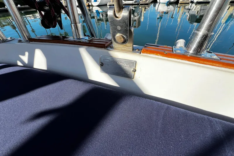 Slide: The Image of 1985 Catalina 36 yacht interior with nameplate, docked at marina. - 26