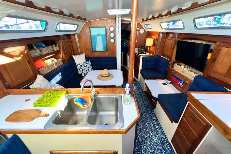Slide: The Image of Interior of a 1985 Catalina 36 sailboat with cozy seating and modern amenities. - 33