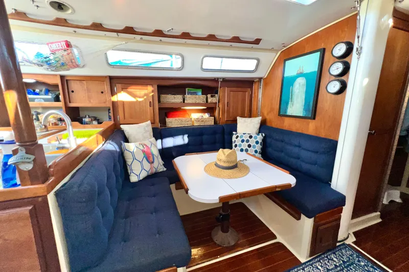 Slide: The Image of Interior of a 1985 Catalina 36 sailboat with cozy seating and nautical decor. - 40