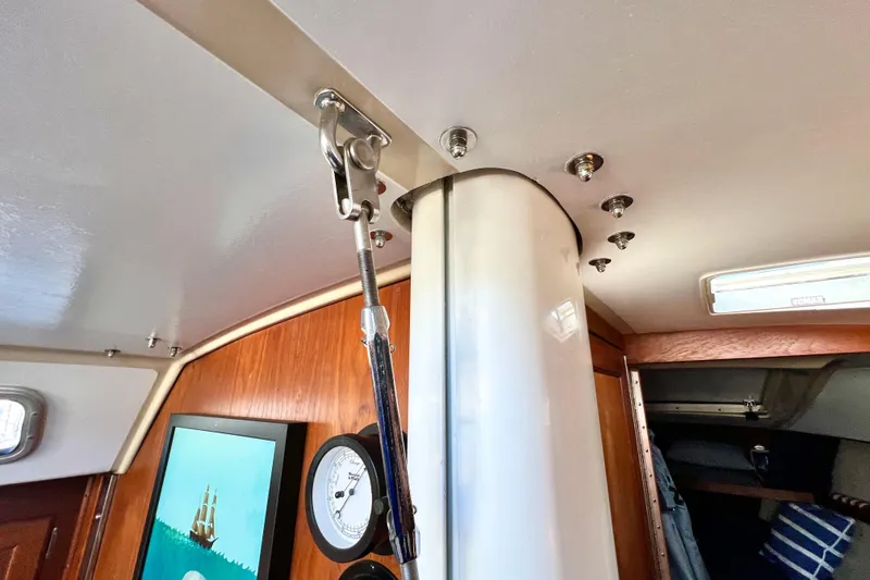 Slide: The Image of Interior of 1985 Catalina 36 sailboat showing mast support and nautical decor. - 47