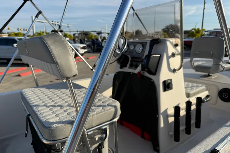 Slide: The Image of 2026 Carolina Skiff E16 JVX CC boat interior with steering console and seating. - 14