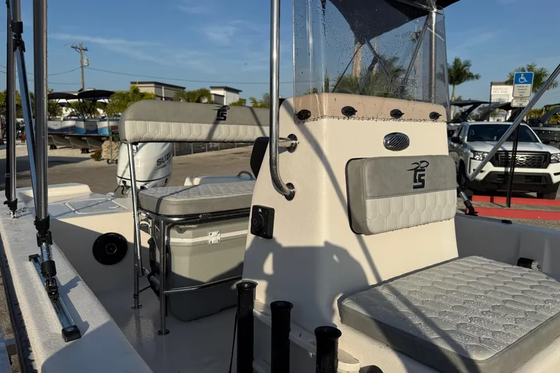 Slide: The Image of 2026 Carolina Skiff E16 JVX CC boat interior with seating and console details. - 16