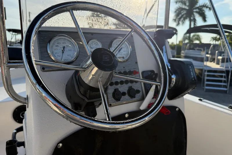 Slide: The Image of Steering wheel and dashboard of 2026 Carolina Skiff E16 JVX CC boat. - 24